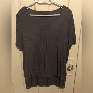 Adorable short sleeve top with lace underlay at the hem